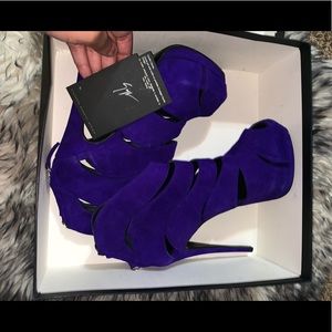 I am selling a pair of purple Giuseppe high heels